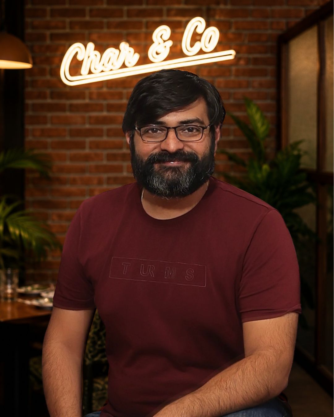 Rohit, founder of Char & Co, tending the smoker